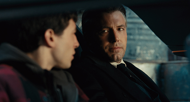 Ezra Miller as Barry Allen and Ben Affleck as Bruce Wayne in Justice League.
