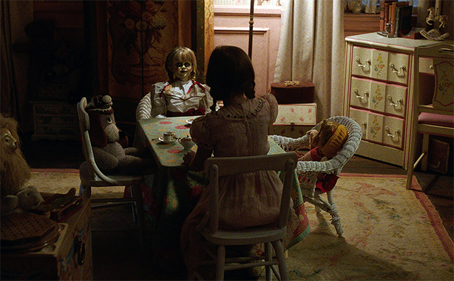 Annabelle sits for a tea party with Bee in Annabelle: Creation