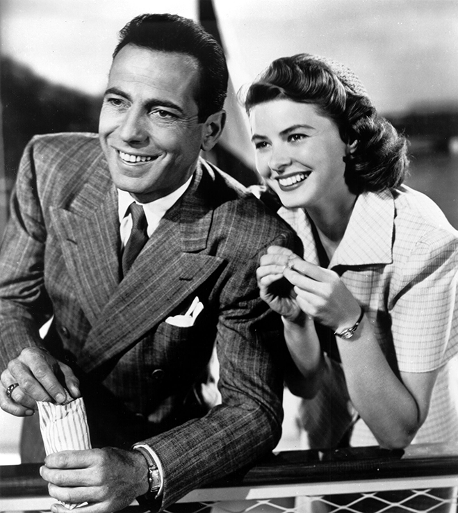 Humphrey Bogart and Ingrid Bergman smiling in a publicity photo